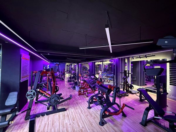 Gym training floor with magenta LED lighting